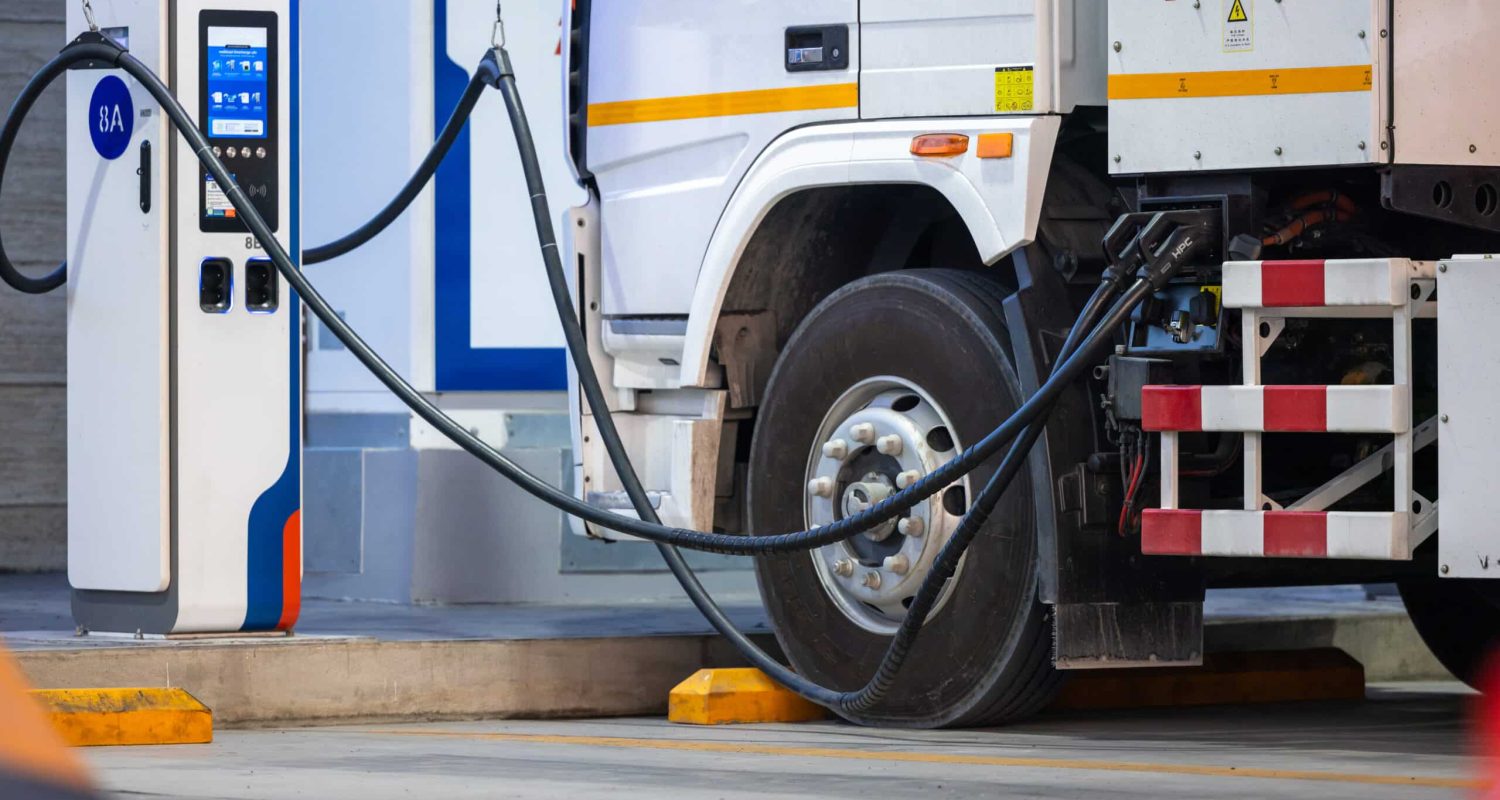 EV charging and semi truck electric vehicle, Electric vehicle semi truck trailer charging station for charge EV battery, Plug for vehicle electric engine, EV charger semi truck trailer station.